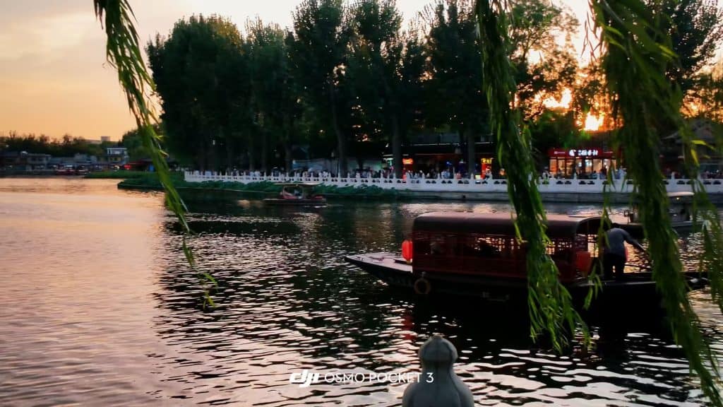 Sunset boating at Shichahai Park with willows in Beijing, China