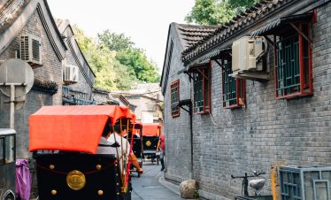 Chinese old street hutong and traditional rickshaws at shichahai in B eijing