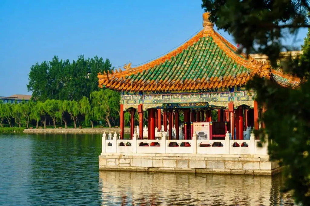 Elegant pavilion on the lake at Beihai Park in summer