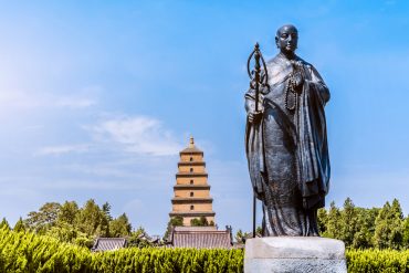 Xuanzang statue and Giant Wild Goose Pagoda under daylight, Xi’an, China.