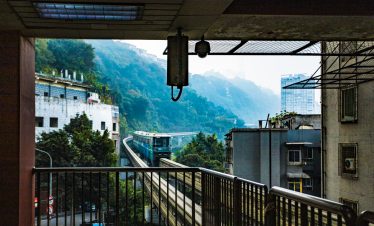 Chongqing metro passing through buildings in Yuzhong, China.