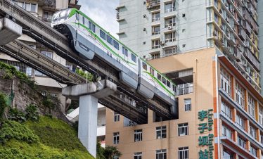 Chongqing metro passing through buildings in Yuzhong, China.
