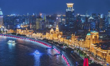 Night view of the Shanghai Bund with dazzling city lights and skyscrapers