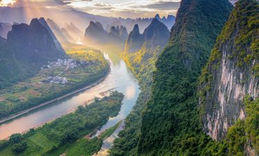 Xianggong Hill viewpoint panorama of beautiful green, lush and dense karst mountain landscape in Yangshuo, Guangxi Province, China, drone shot
