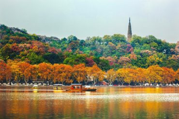 Vibrant red leaves in autumn at West Lake, Hangzhou, China.