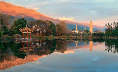 Chongsheng Three Pagodas at sunset with Erhai Lake in the foreground in Dali, Yunnan
