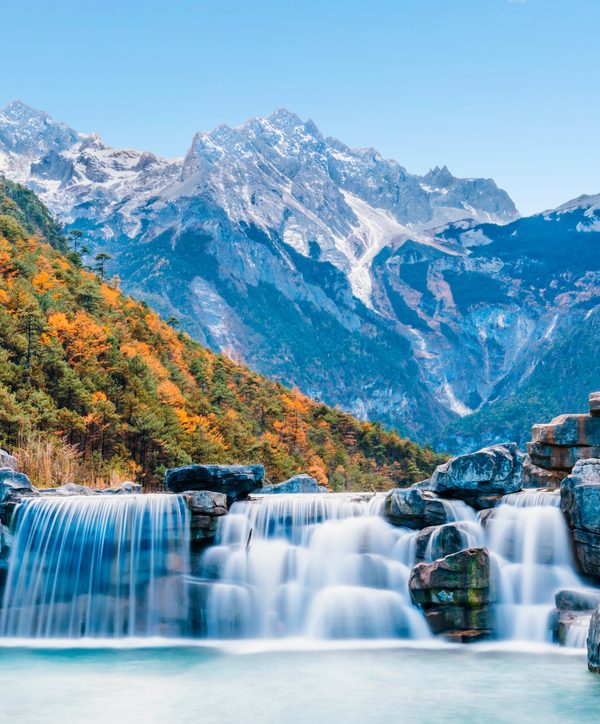 Waterfall cascading into Blue Moon Valley at Jade Dragon Snow Mountain, Lijiang, Yunnan
