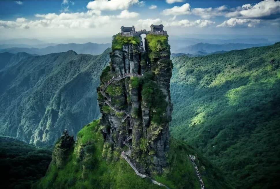Fanjingshan Mountain towering into the clouds on a sunny day in Guizhou, China