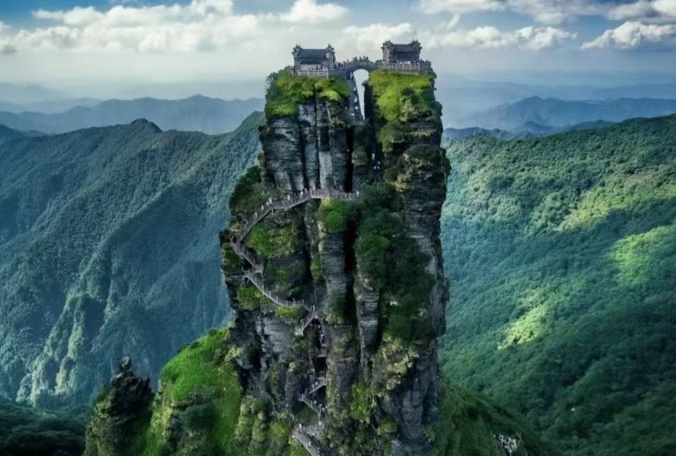 Fanjingshan Mountain towering into the clouds on a sunny day in Guizhou, China