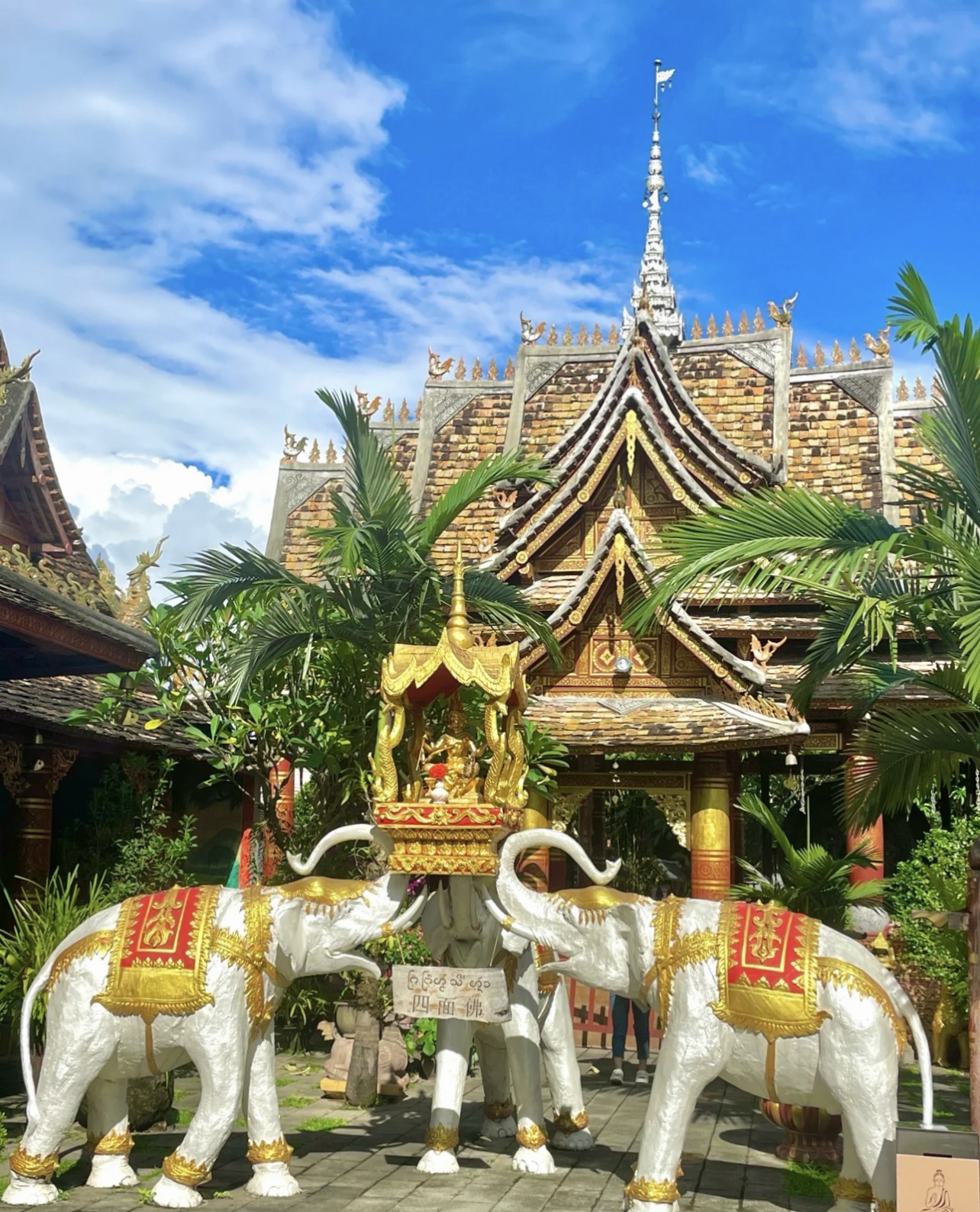 Buddhist architecture and white elephant statue at Xishuangbanna Dai Ethnic Garden