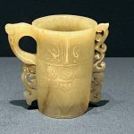 A delicate jade pencil holder displayed in the Shanghai Museum, China, exemplifying exquisite artistry.