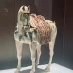 A vibrant ceramic horse in the Shanghai Museum, China, showcasing ancient craftsmanship.