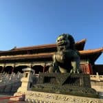 Majestic stone lions guarding the entrance of the Forbidden City in Beijing, China.