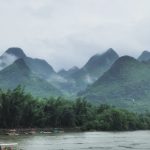The mist-covered Li River landscape in Guangxi, China, creating a mystical atmosphere.