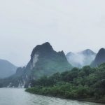 The mist-covered Li River landscape in Guangxi, China, creating a mystical atmosphere.