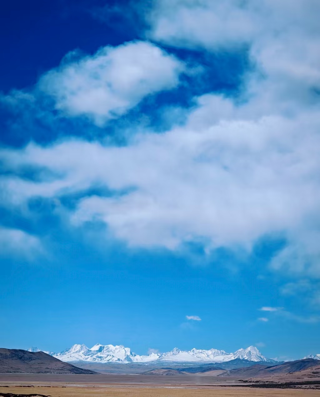 Snow-capped mountains in Darchen under clear sky