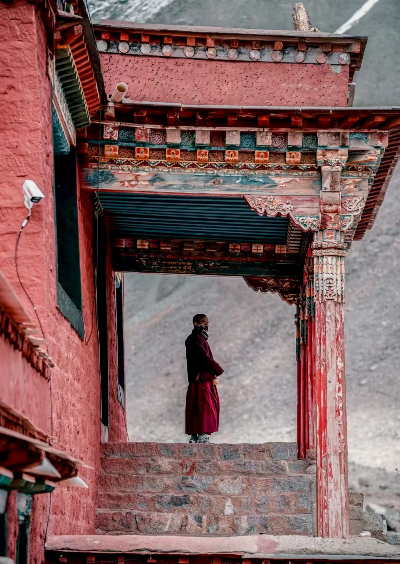 Monk at the entrance of Zhire Monastery in Tibet
