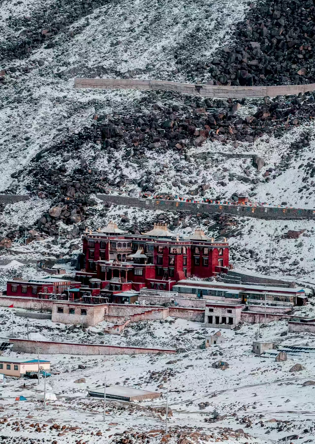 Zhire Monastery surrounded by snowy landscape in Tibet