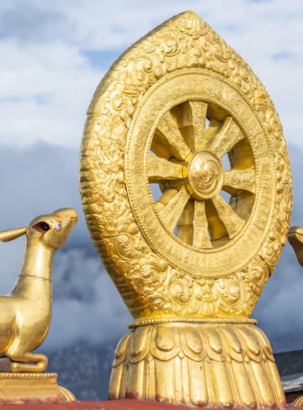 Golden roof of Jokhang Temple with deer and Dharma wheel in Tibet