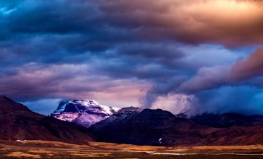 Sacred Mount Kailash under dramatic changing sky in Tibet