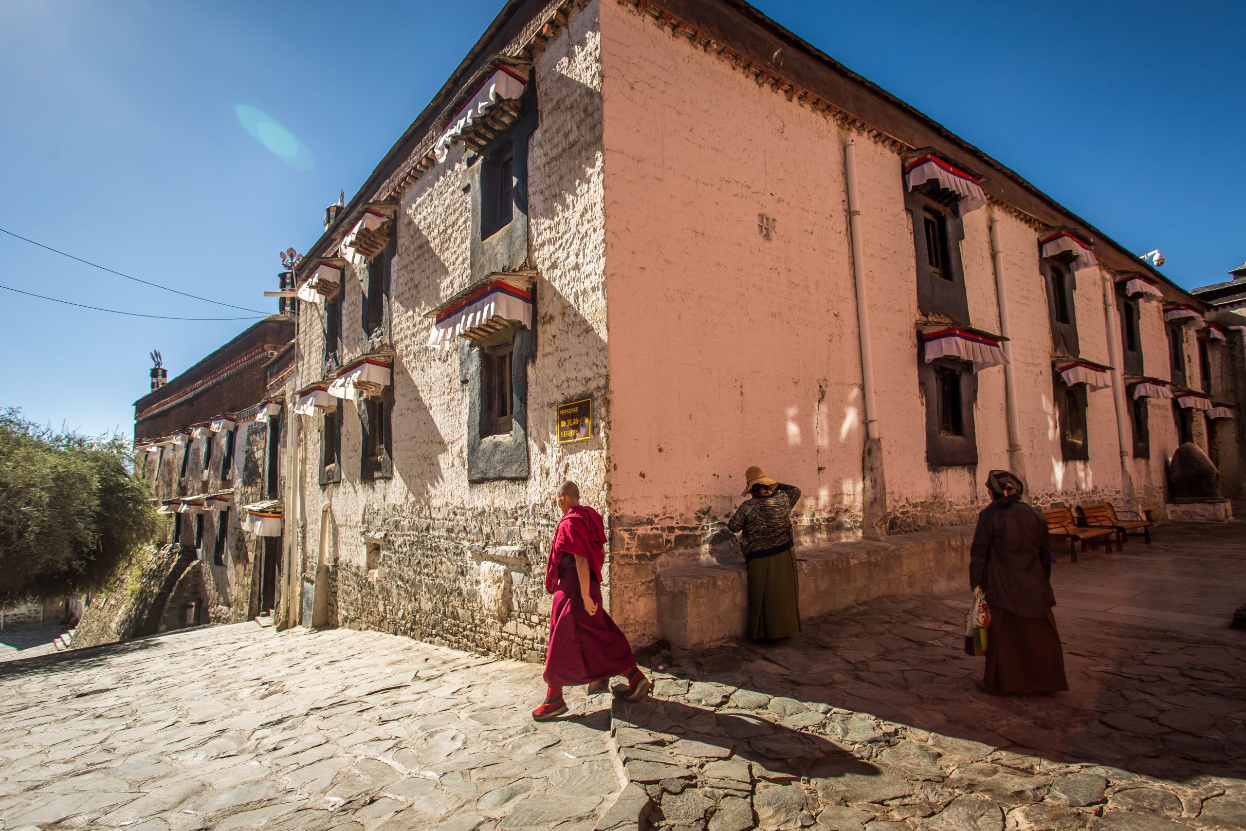 A monk from Tashilhunpo Monastery walking in Tibet