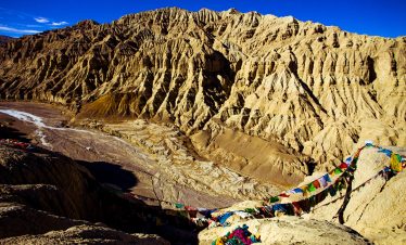 Zanda Earth Forest with scattered colorful prayer flags in Tibet
