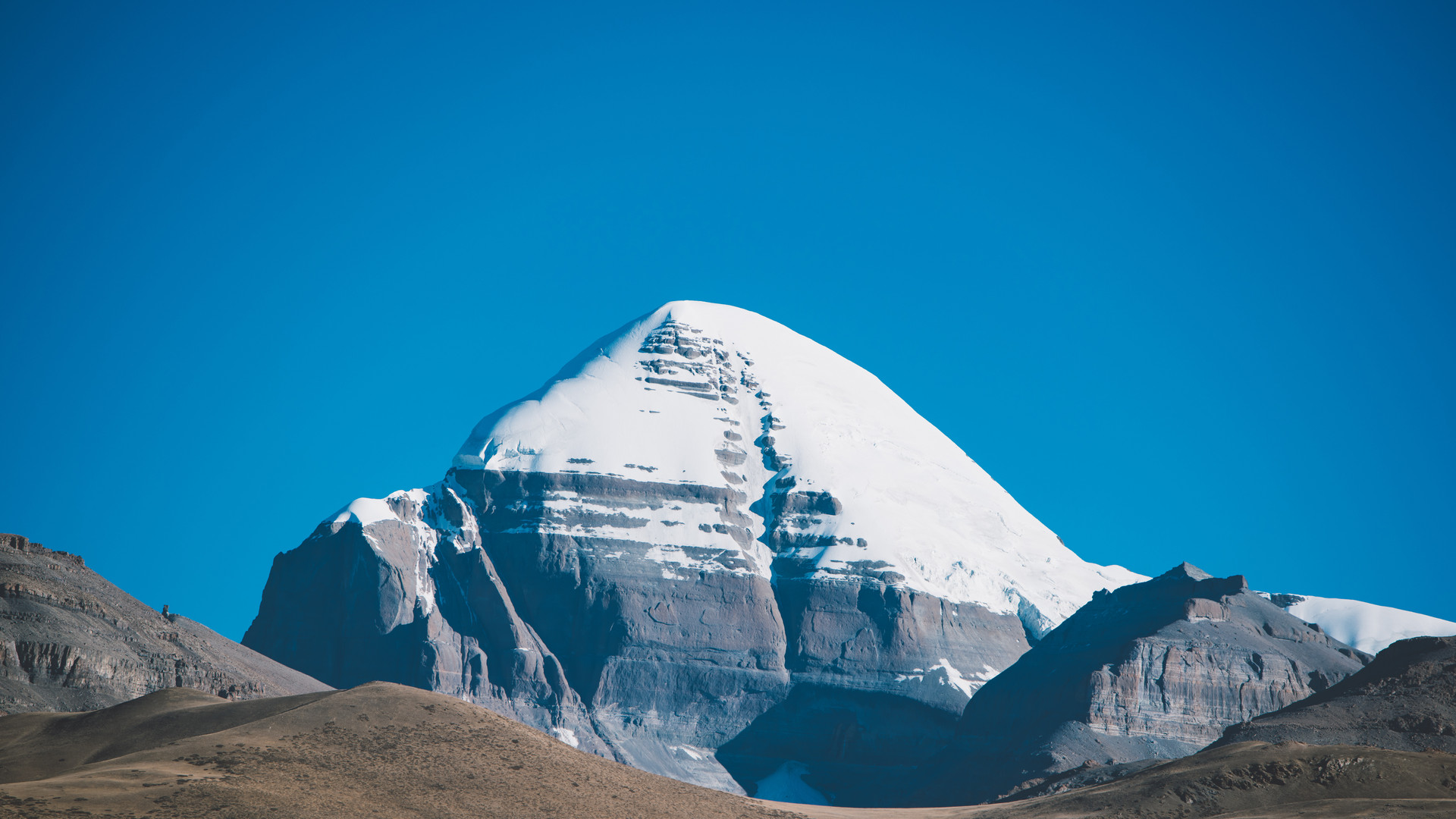Snowy Mount Everest under clear blue sky in Tibet