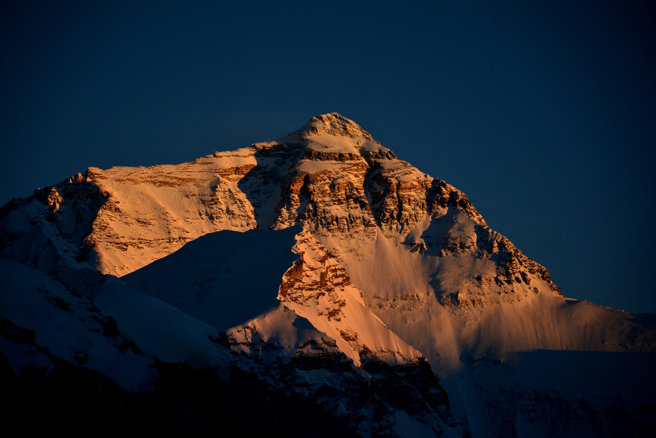 Mount Everest glowing in sunset light in Tibet