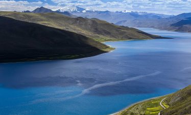 Clear blue water surface of Yamdrok Lake in Tibet