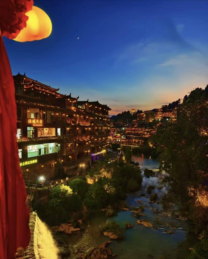 Beautiful night scenery of Furong Ancient Town seen from a window in Hunan, China