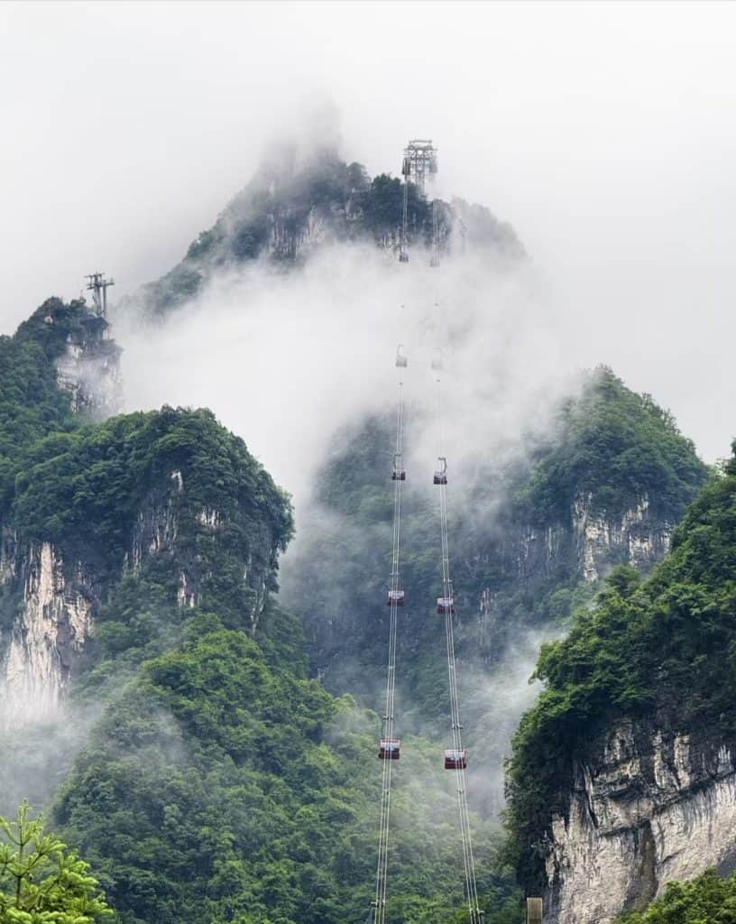 Tourists riding cable cars between scenic spots at Zhangjiajie National Forest Park in Hunan, China