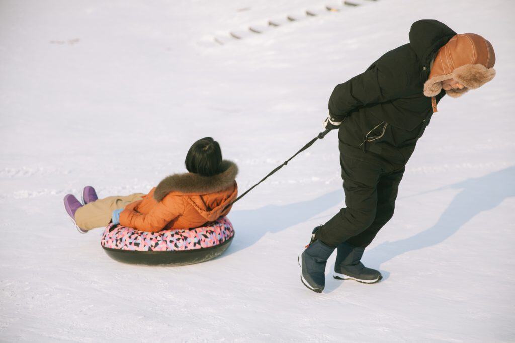 Fun snow sledding activity at Harbin Ice and Snow Festival, China